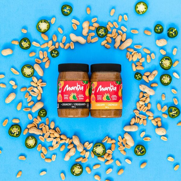 Spicy Manba Peanut Butter surrounded by peanuts sand jalapenos
